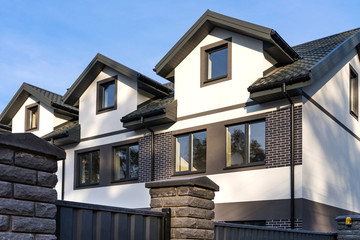 Townhouse under construction. Apartment residential buildings backgrounds.