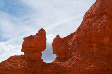 Fototapeta premium Bryce Canyon, Utah National Park. Incredible mountain landscape of American nature. Traveling in America, a tourist place trekking. Walking trip. Layout for design, copy space, sky with clouds.