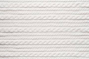 White Knit Fabric Background. Wool Sweater Texture Close Up