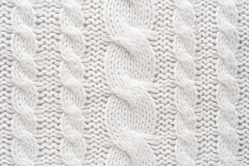 White Knit Fabric Background. Wool Sweater Texture Close Up