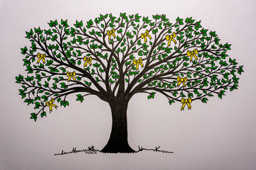 Baum mit gelben Schleifen