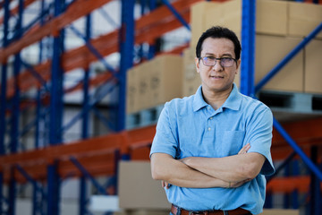 Asian man owner mananger of SME business warehouse storage