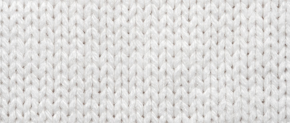 White Knit Fabric Background. Wool Sweater Texture Close Up