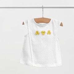 T-shirt for baby-girl hanging on a shoulders (hanger) isolated on white background