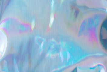 Holographic Foil Texture. Abstract soft pastel iridescent background. Rainbow color sunlight spots and gradient.