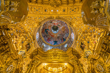 Fototapeta na wymiar Finely golden ornate dome in the Basilica of San Juan de Dios in Andalusia, Granada, Spain.