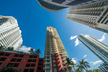 Looking directly up at highrise buildings