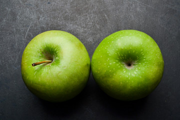 Green apple top view on background