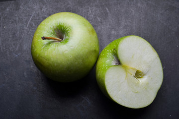 Green apple top view on background