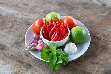 chilli in cup on board wood turn up and Vegetable