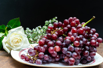 Grape fresh on table in black background