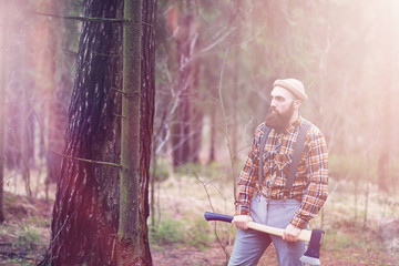 A bearded lumberjack with a large ax