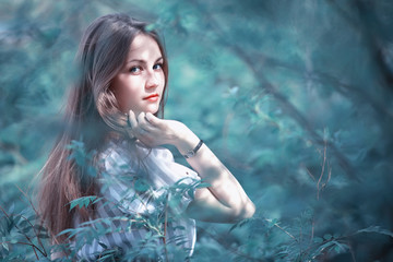 A girl in a spring green park