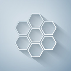 Paper cut Honeycomb sign icon isolated on grey background. Honey cells symbol. Sweet natural food. Paper art style. Vector Illustration