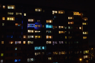 Fototapeta premium Windows pattern, colored Christmas lights on a dark night background