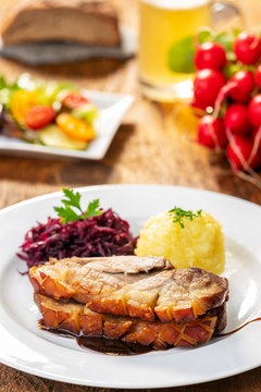 bavarian roasted pork with dumplings and cabbage