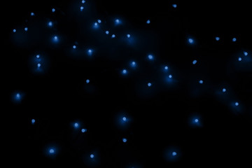 Holiday festive blue background with bokeh on black background