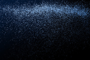 Christmas Gold glitter on black background. Holiday abstract