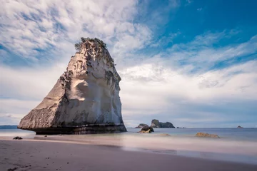 Fototapeten The big rock at the beach cathedral cove in Coromandel, New Zealand - longexposure photography © Jimmy R