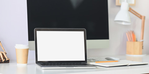 Mockup laptop computer on comfortable workspace.