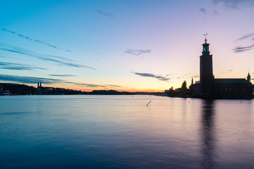 Panoramic view of Riddarfjarden Stockholm City Hall at sunset time.