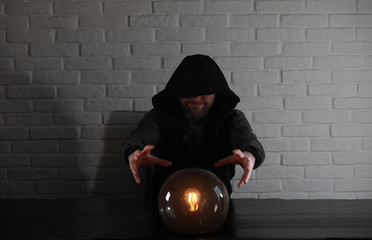 A man with a fortune teller ball