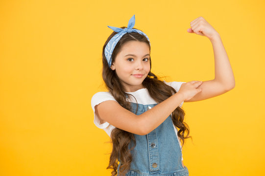Cute small kid fashion girl. Fashion accessories. Power. Strong baby. Fashion trend. Summer vacation. Girl long curly hair bandana knot. Little fashionista. Happy childhood. Modern teen clothing