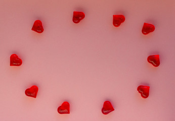 Hearts on a pink background. Valentin's Day, top view. Copy space. Flat lay. Greeting card.