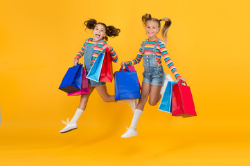 Total sale. Kids fashion. Holiday purchase saving. Home shopping. Buyer consumer concept. Small girls with shopping bags. Sales and discounts. Happy children. Little girls with gifts. Summer shopping