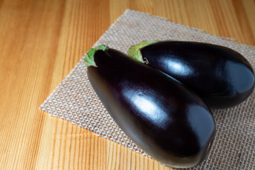 eggplants on a wooden kitchen table
