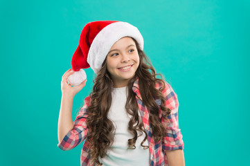 Cherished dreams. Waiting for Santa. Spread joy and love, it is Christmas season. Little girl child in santa hat. Present for xmas. New year party. Santa claus kid. Happy winter holidays. Small girl