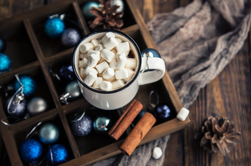 Obraz na płótnie Canvas Cup of coffee and marshmallow on Christmas wooden background.
