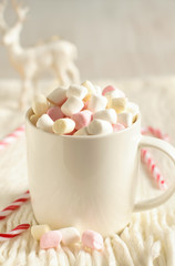 Winter warming sweet drink hot chocolate with marshmallows and cocoa in mug