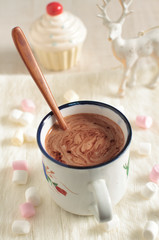 Rich winter hot chocolate with cinnamon sticks and spices