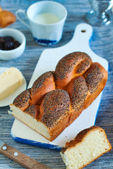 Homemade braided simple vanilla sweet bread for breakfast with poppy seeds