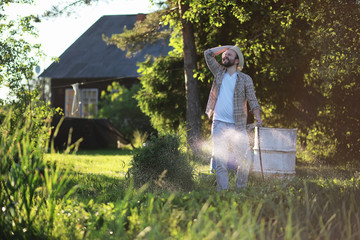Man farmer watering a vegetable garden