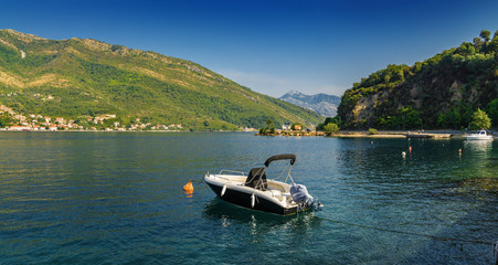 Fototapeta na wymiar Sunny morning view of Kotor bay and coastal road near Tivat, Montenegro.