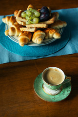 breakfast with croissants and coffee