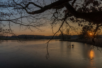 Rouda and Olesnicky novy pond in sunset time in winter evening