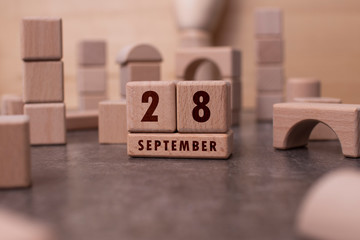 September 28 written with wooden blocks
