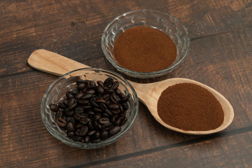 Roasted coffee beans, ground coffee, Cup of coffee, Wooden spoon with roasted coffee