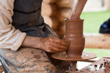 professional potter making jugs