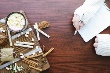 Winter breakfast. A cup of hot chocolate with marshmallows and freshly baked cookies. Gingerbread cookie and coffee.