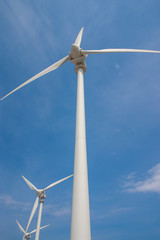 Row of wind turbines, generating clean, sustainable, alternative electrical energy