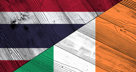 Flag of Thailand and Ireland on wooden boards