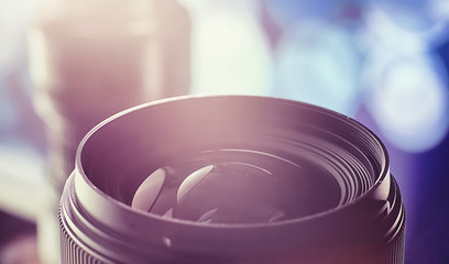 Equipment videographer and photographer. Lenses on the table against the background of bright...