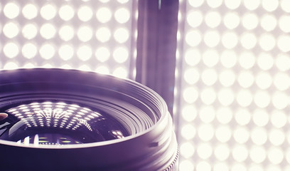 Equipment videographer and photographer. Lenses on the table against the background of bright...