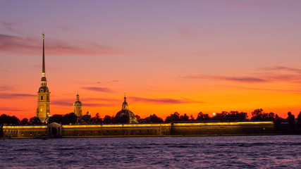 Peter and Paul Fortress against the backdrop of a crimson sky