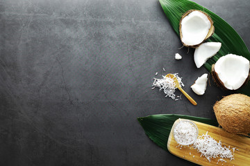 Coconut on a dark stone table. Coconut oil.