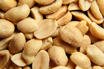 Beer snack. Salty roasted peeled peanuts closeup